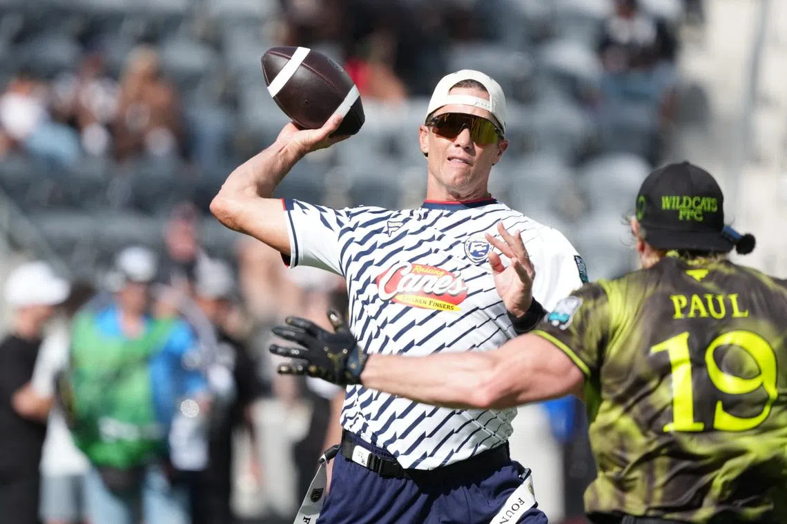 Mar 21, 2026; Los Angeles, CA, USA; Founders FFC quarterback Tom Brady (12) throws ball against Logan Paul of Wildcats FFC during the Fanatics Flag Football Classic at BMO stadium. Mandatory Credit: Kirby Lee-Imagn Images