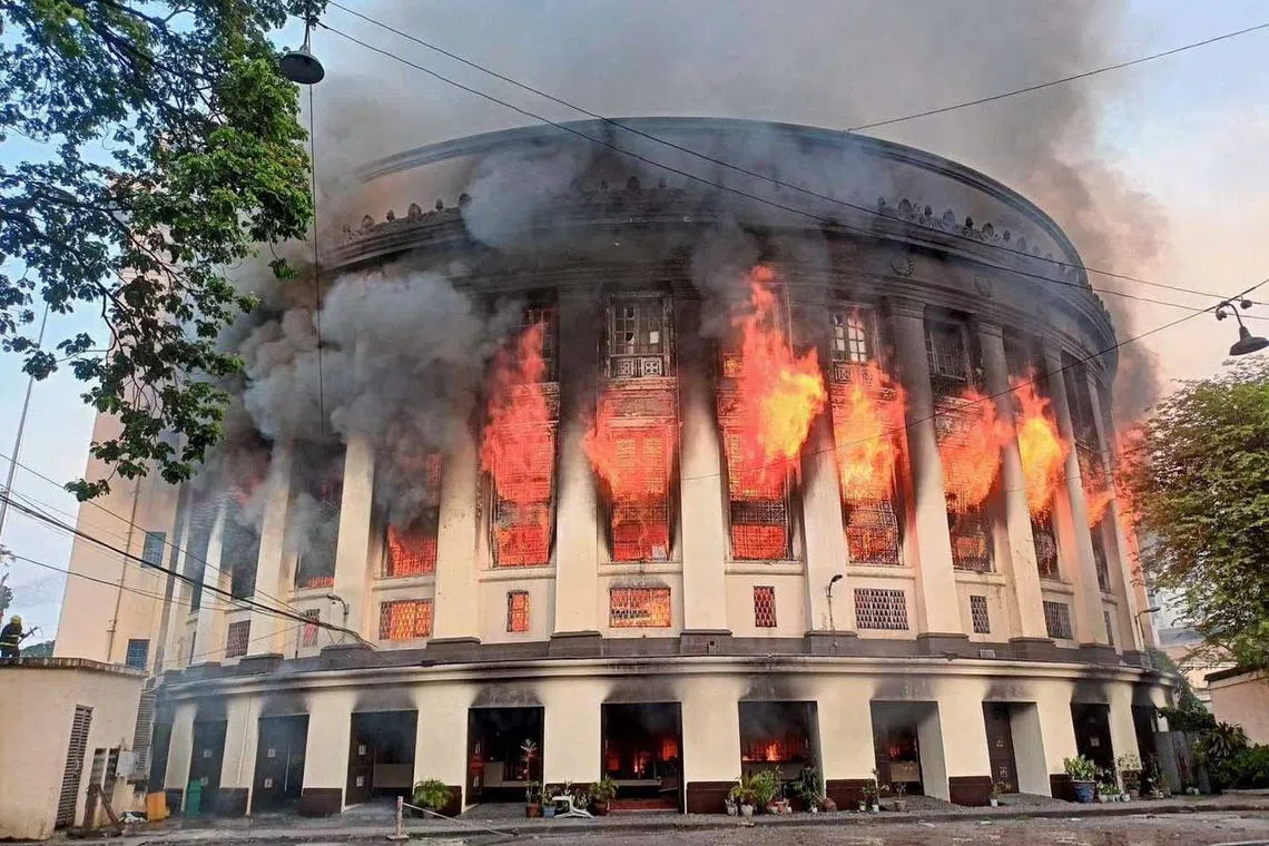 Smoke erupts as a massive fire hits Manila Central Post Office building in Manila, Philippines, May 22.