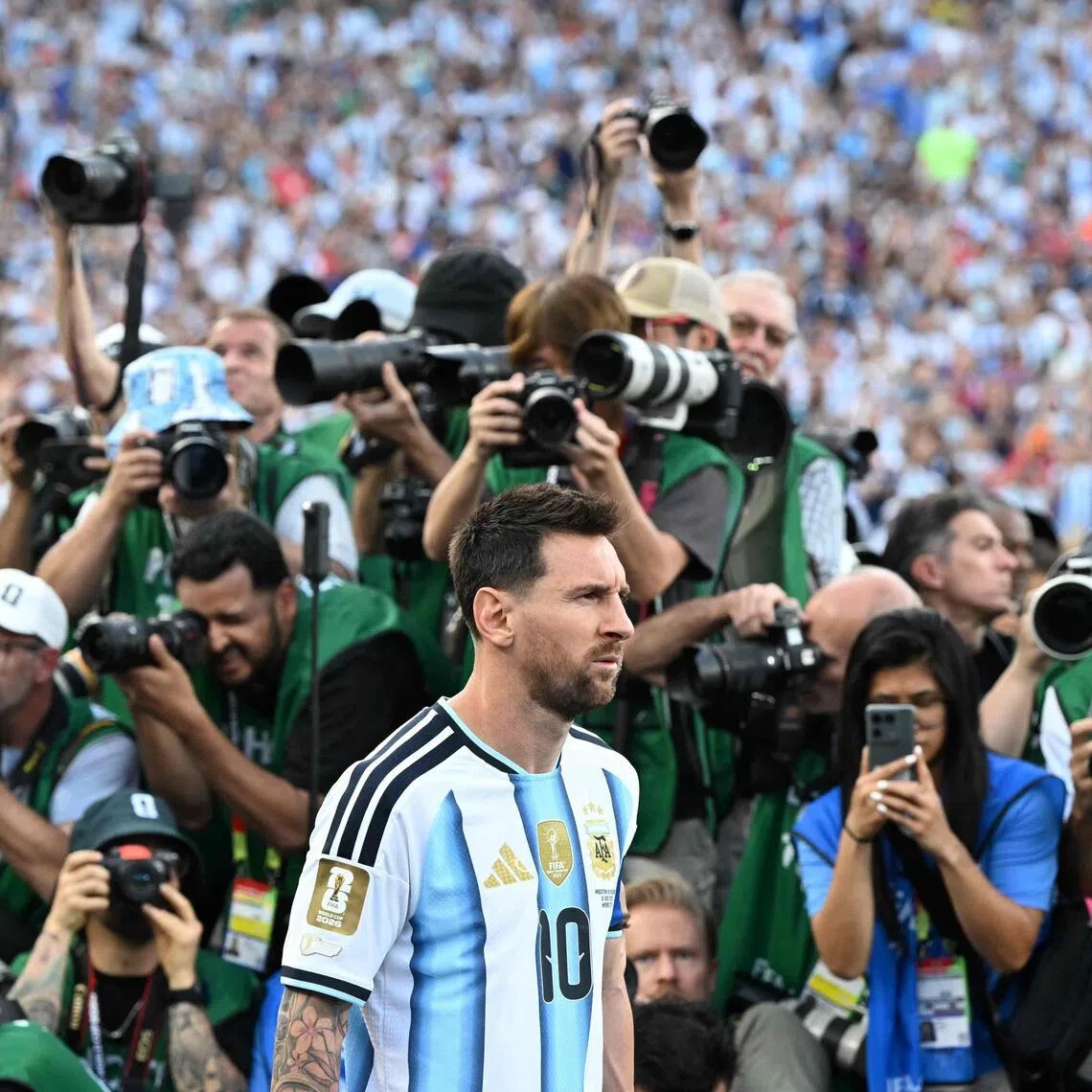 Lionel Messi entering the pitch to a throng of media attention ahead of his three-goal showing in Argentina's 3-0 2026 World Cup opening win over Algeria at Arrowhead Stadium in Kansas City on June 16.