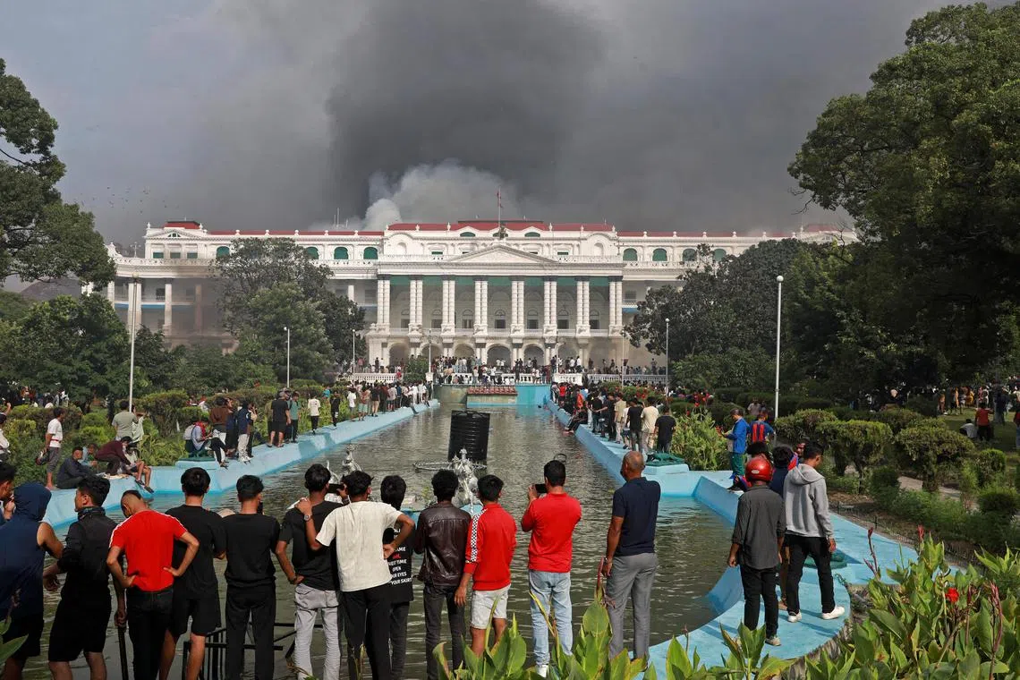Protesters gather at the Singha Durbar, the main administrative building for the Nepal government, in Kathmandu on Sept 9.