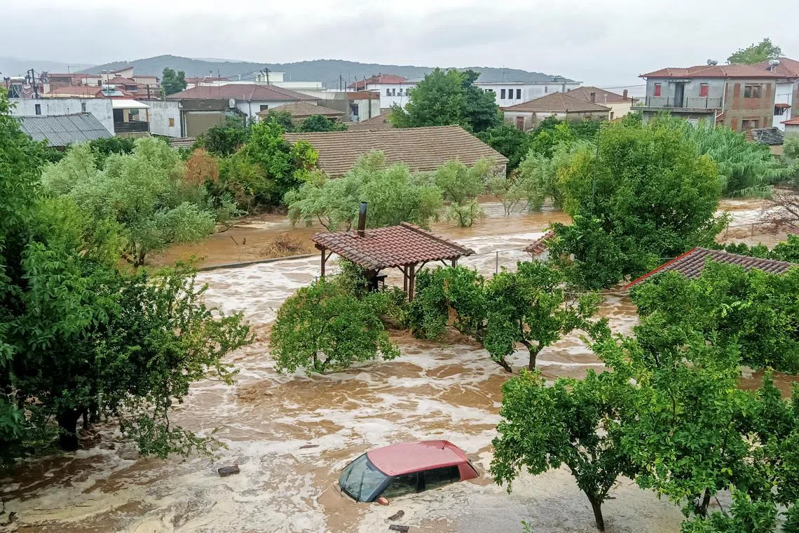 A car is submerged underwater during a storm on Mount Pelion, near Volos, Greece.