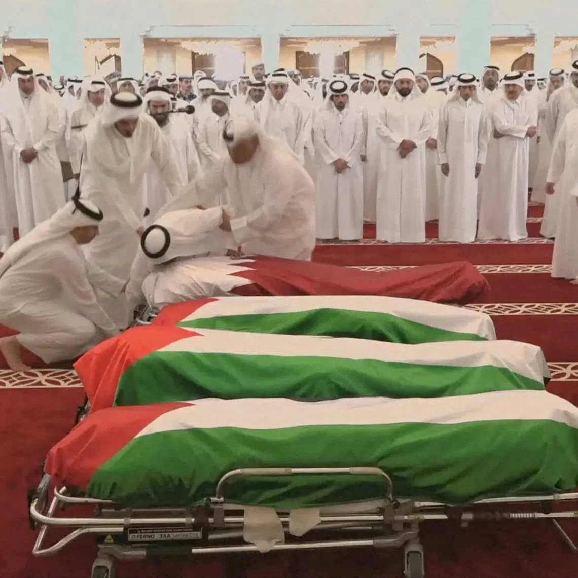 FILE PHOTO: People attend a funeral held for those killed by an Israeli attack in Doha, including Corporal Badr Saad Mohammed Al-Humaidi Al-Dosari, a member of the Internal Security Force, at the Sheikh Mohammed bin Abdul Wahhab Mosque in Doha, Qatar, September 11, 2025, in this screengrab obtained from a video feed. Qatar TV/Reuters TV via REUTERS./File Photo