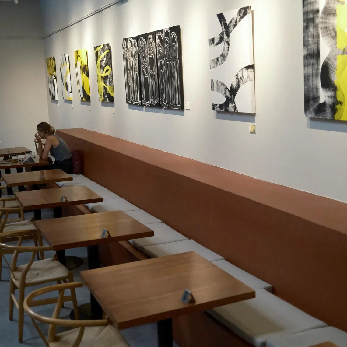 Customers sit with empty tables visible at Lila Molino restaurant in Dubai, United Arab Emirates, April 28, 2026. REUTERS