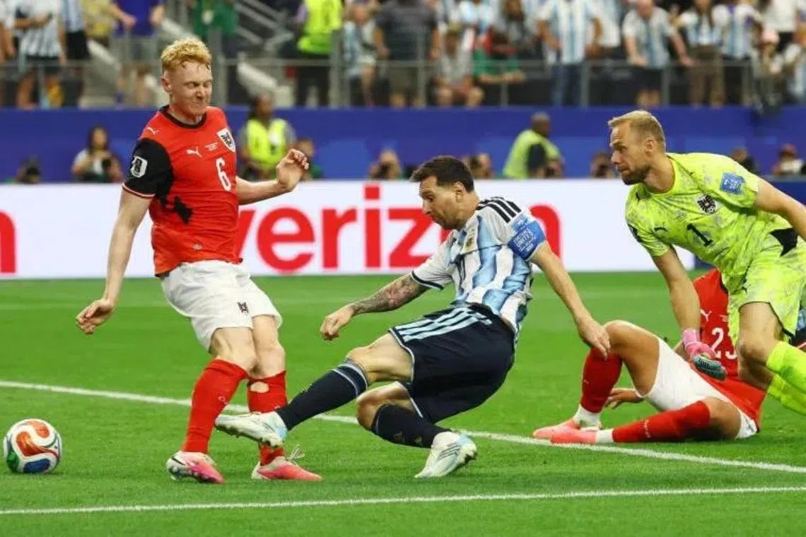 Argentina's Lionel Messi scores their second goal to give his team a 2-0 win over Austria in Arlington, Texas.