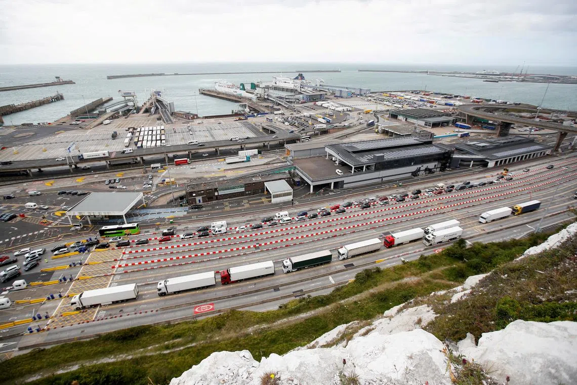 FILE PHOTO: Vehicles queue at the border control booths at the Port of Dover, in Dover, Britain July 25, 2022. REUTERS/Peter Nicholls/File Photo