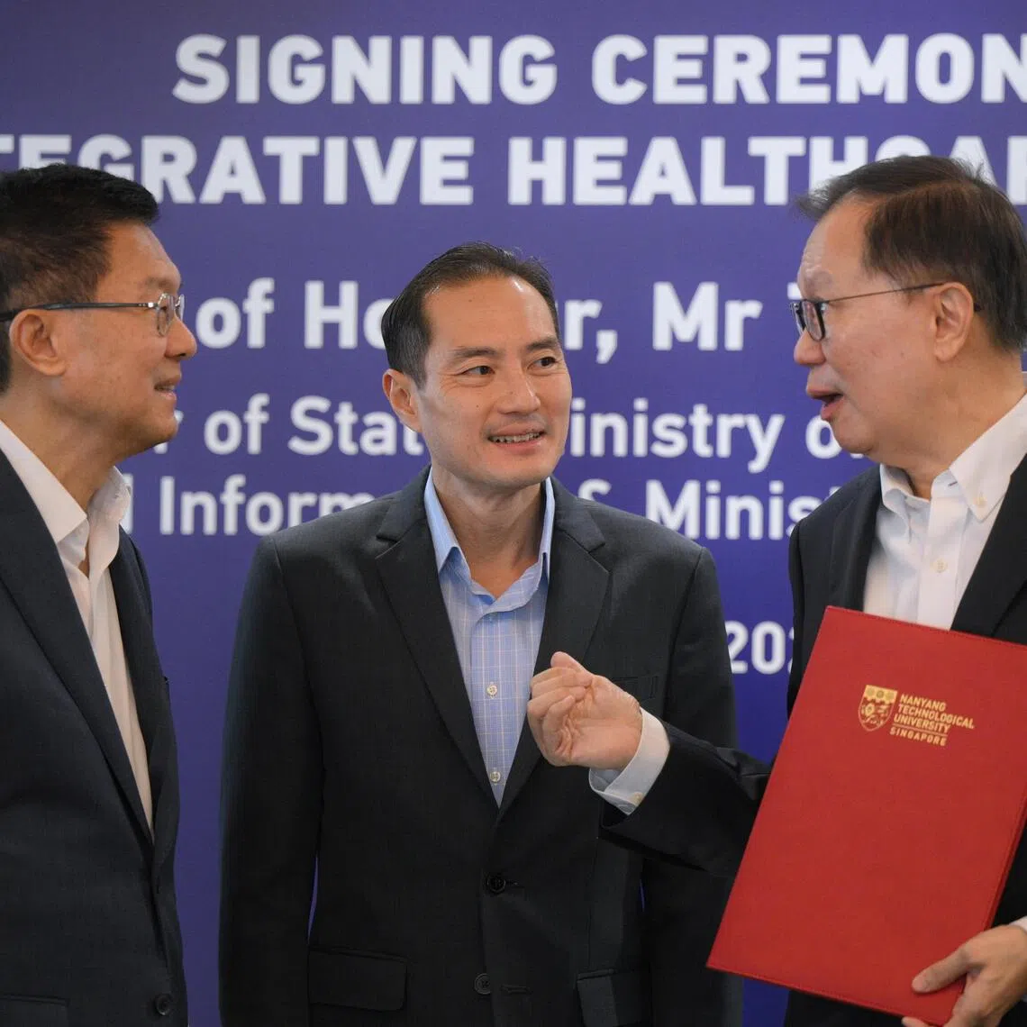 From left, Dr Stephen Riady, Founder, Stephen Riady Foundation, and Executive Chairman and Group Chief Executive Officer, OUE Limited, Tan Kiat How, Senior Minister of State, Ministry of Digital Development and Information and Ministry of Health and Professor Ho Teck Hua, President, NTU, chat after the Gift Agreement Signing Ceremony for “Stephen Riady Professorship in Healthcare and Technology” at NTU on Aug 17.