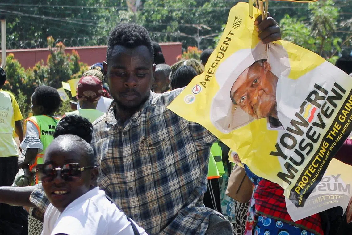 Supporters of Uganda's President and the leader of the ruling National Resistance Movement (NRM) party, Yoweri Museveni, march along the streets as they prepare for his campaign at the Nakawa division of Kampala, Uganda, January 7, 2026. REUTERS/Michael Muhati
