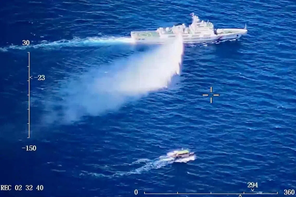 A Chinese Coast Guard ship launches what the Coast Guard says is a warning water cannon spray in the direction of a Philippine vessel at an unknown location at sea in this screen grab taken from a video released on August 8, 2023. China Coast Guard/Handout via REUTERS    THIS IMAGE HAS BEEN SUPPLIED BY A THIRD PARTY MANDATORY CREDIT. NO RESALES. NO ARCHIVES. REUTERS IS UNABLE TO INDEPENDENTLY VERIFY THE VIDEO.     TPX IMAGES OF THE DAY     