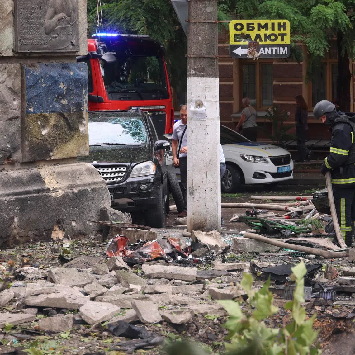 Ukrainian rescuers work at the site of the Russian strike on the residential area in Odesa, Ukraine on July 21.