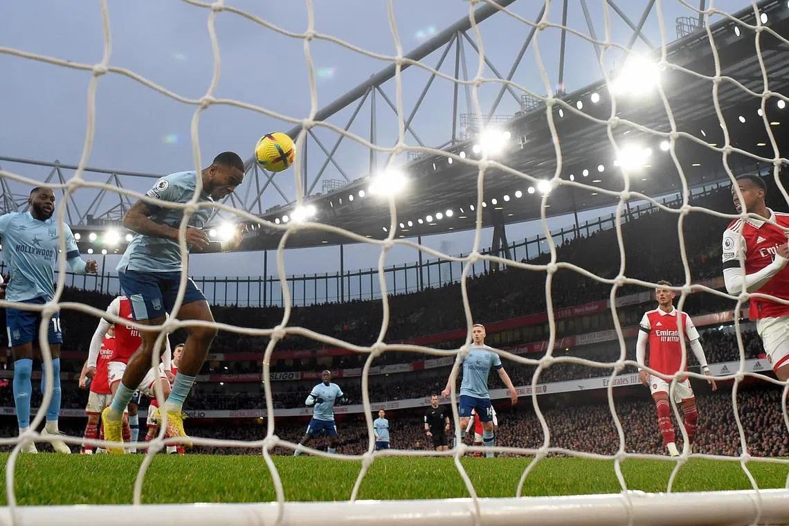 Brentford's Ivan Toney (left) scores via a header the equaliser goal against Arsenal, on Feb 11, 2023.