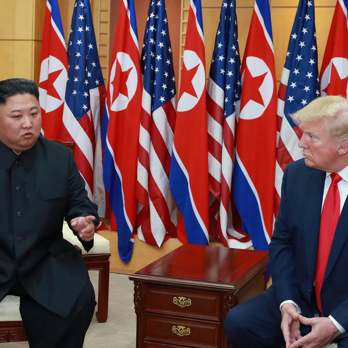 U.S. President Donald Trump speaks with North Korean leader Kim Jong Un during a meeting at the demilitarized zone (DMZ) separating the two Koreas, in Panmunjom, South Korea, June 30, 2019. KCNA via REUTERS/FILE PHOTO