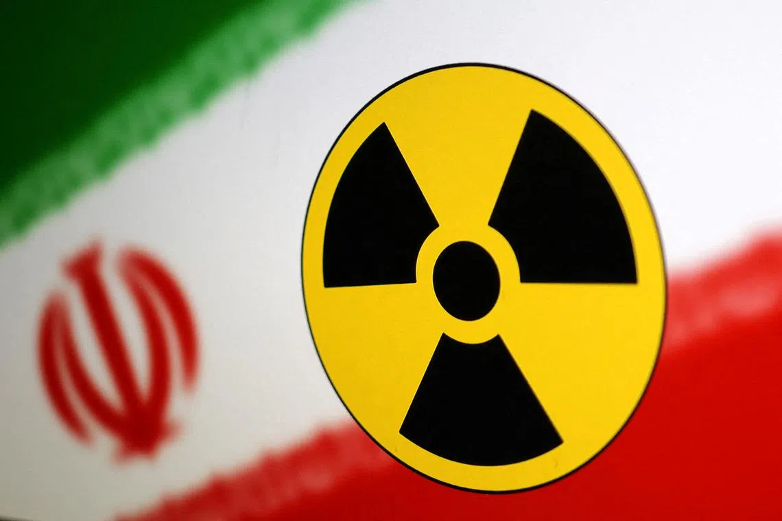 FILE PHOTO: Nuclear symbol and Iran flag are seen in this illustration, July 21, 2022. REUTERS/Dado Ruvic/Illustration/File Photo