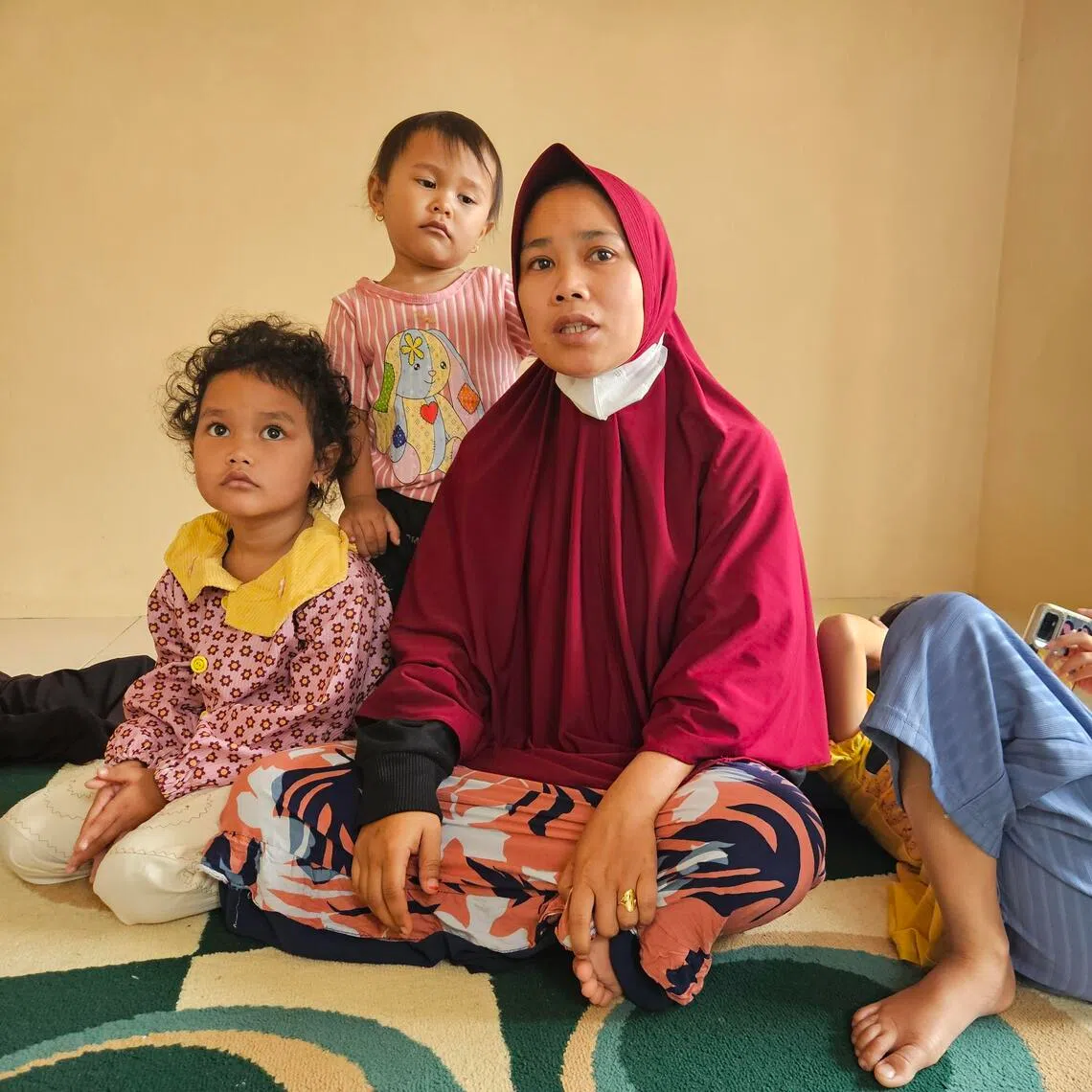 wysumatra// Widowed by the recent flash flood in Sumatra, full-time housewife Ms Ratnawati told The Straits Times that she now faces the difficult task of finding work so she can continue caring for her four children. Her late husband had worked as a waiter at a local restaurant.
