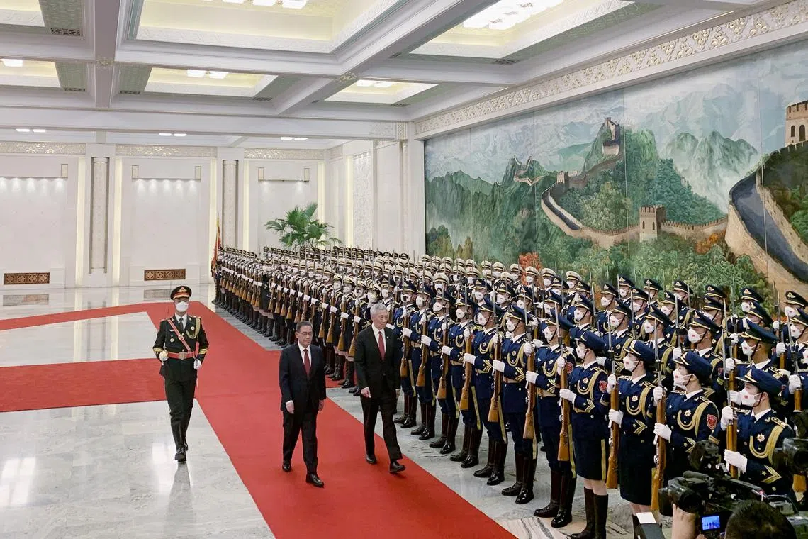 Prime Minister Lee Hsien Loong inspecting a guard of honour, accompanied by Chinese Premier Li Qiang, in the Great Hall of the People in the west of Beijing’s Tiananmen Square on April 1.
