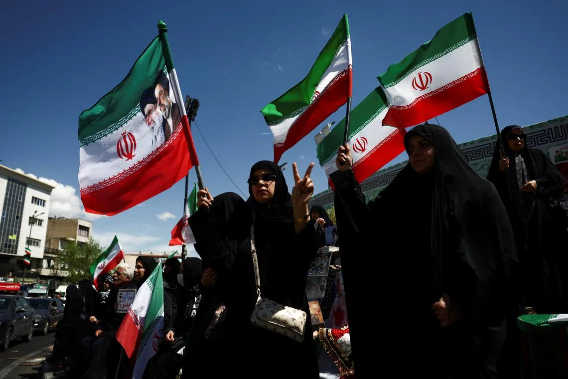 People gather after U.S. President Donald Trump said that he had agreed to a two-week ceasefire with Iran, in Tehran, Iran, April 8, 2026. Majid Asgaripour/WANA (West Asia News Agency) via REUTERS