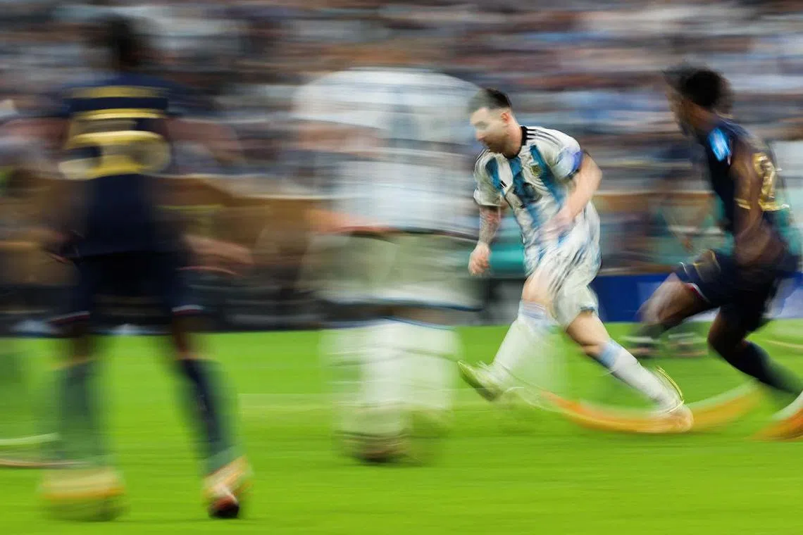 Argentina's forward Lionel Messi (second from right) controls the ball during the game.