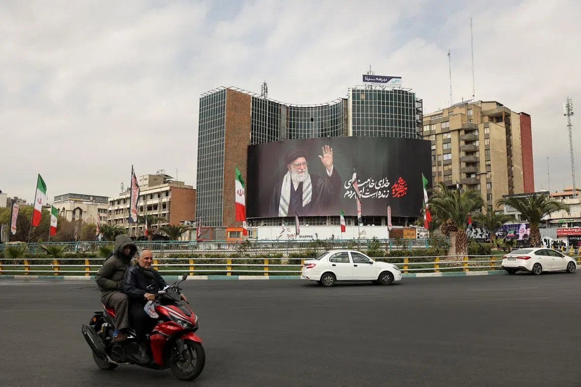 Iran's Supreme Leader Ayatollah Ali Khamenei is seen on a billboard in Tehran on March 2, a day after his death was announced. 
