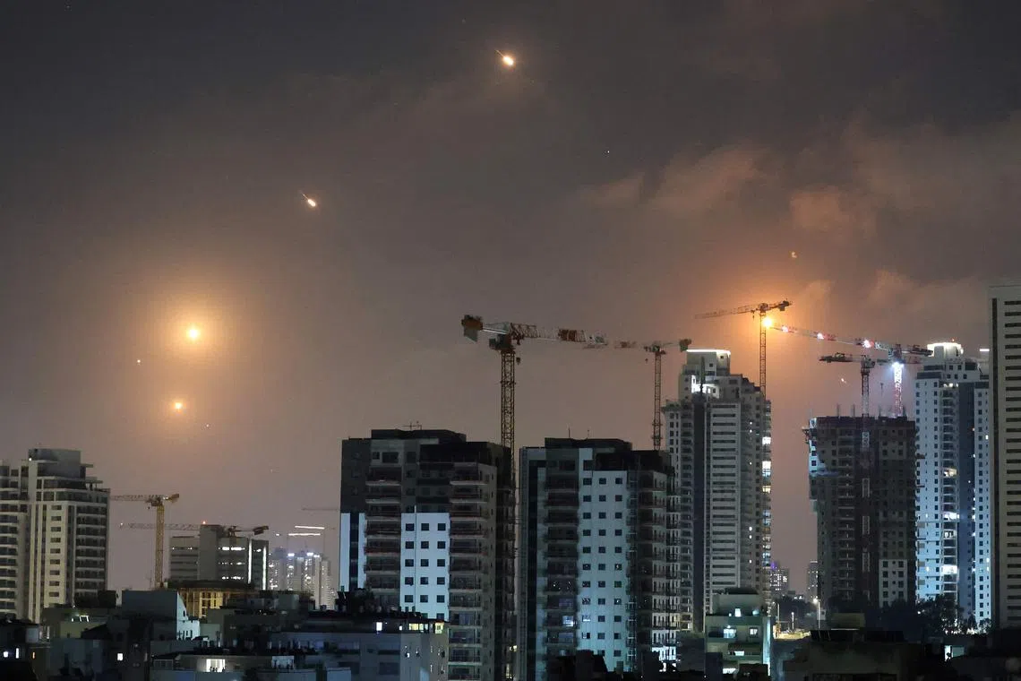 Rocket trails in the sky above Netanya, Israel, on June 13.