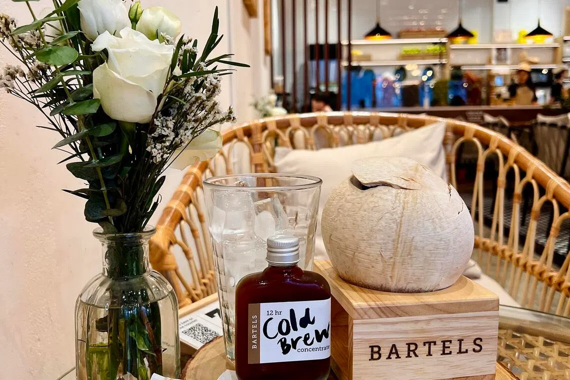 A bottled 12-hour cold brew concentrate served with fresh coconut water and ice at Bartels Asok.