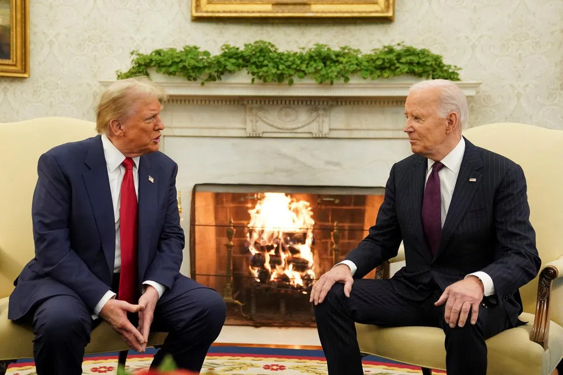 FILE PHOTO: U.S. President Joe Biden meets with President-elect Donald Trump in the Oval Office at the White House in Washington, U.S., November 13, 2024. REUTERS/Kevin Lamarque/File Photo