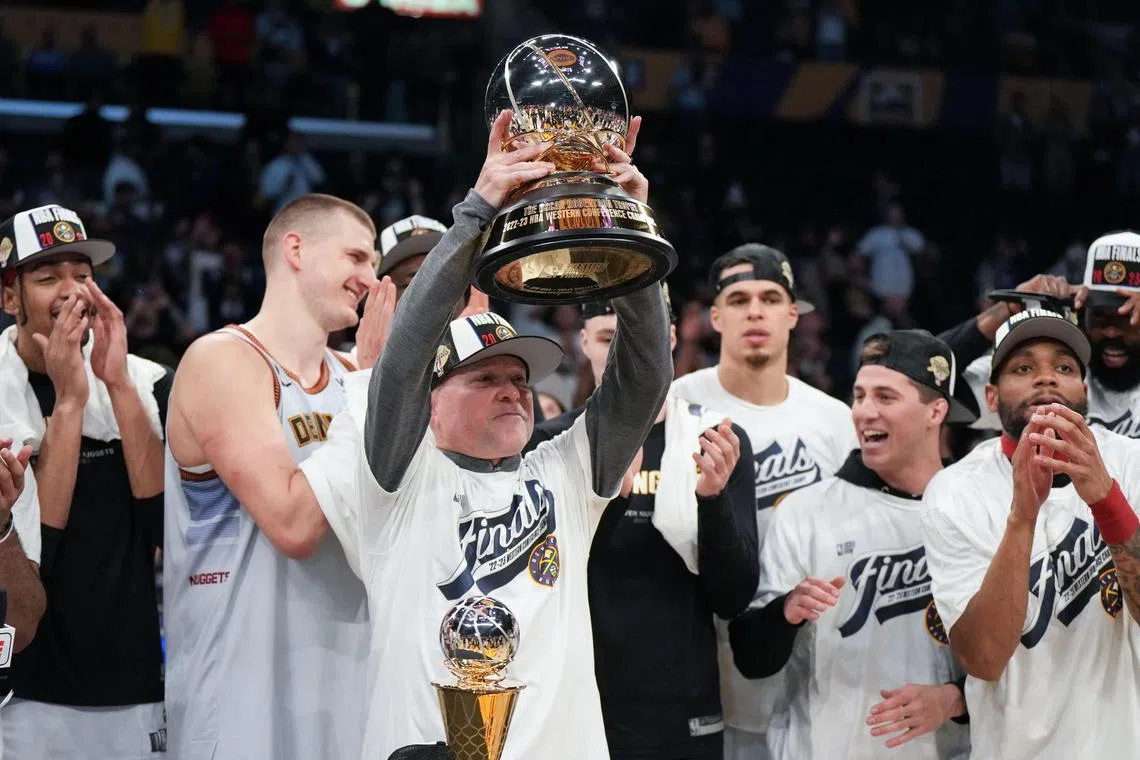 Denver Nuggets head coach Michael Malone celebrates beating the Los Angeles Lakers in Game 4 of the NBA Western Conference Finals.