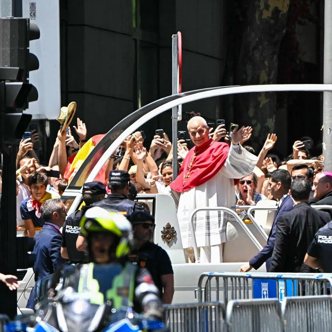 Pope Leo in Madrid on June 6. The pontiff has frequently been seen doing the 6-7 hand gesture on popemobile rides.