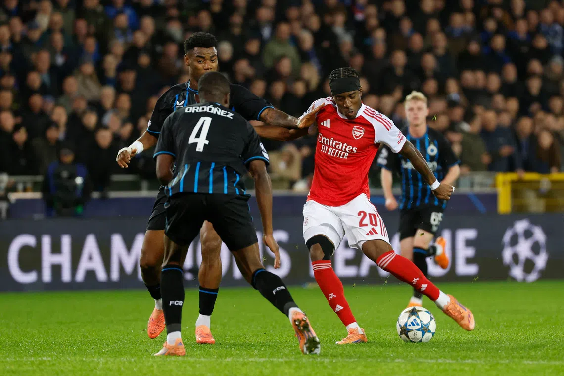 Soccer Football - UEFA Champions League - Club Brugge v Arsenal - Jan Breydel Stadium, Bruges, Belgium - December 10, 2025 Arsenal's Noni Madueke scores their first goal REUTERS/Geert Vanden Wijngaert