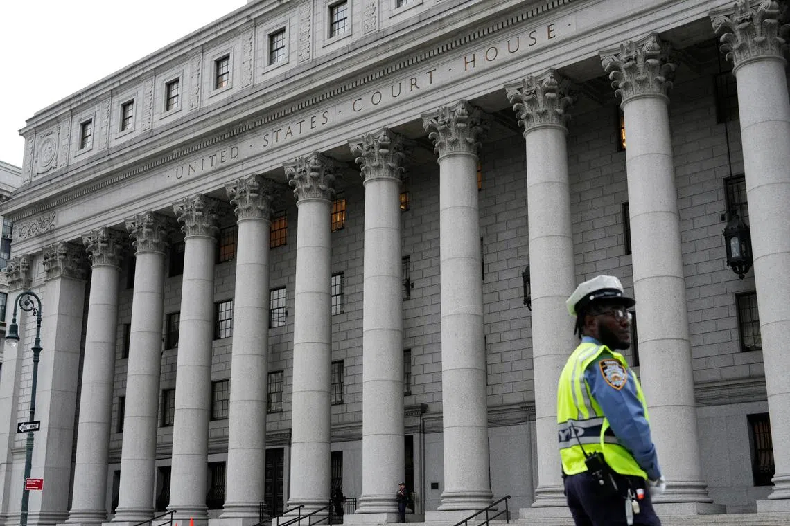 FILE PHOTO: An NYPD officer stands guard before the 2nd U.S. Circuit Court of Appeals in Manhattan, New York, U.S., September 6, 2024. REUTERS/Adam Gray/File Photo