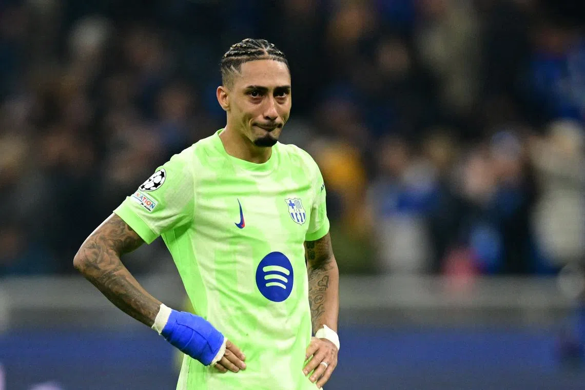 FILE PHOTO: Soccer Football - Champions League - Semi Final - Second Leg - Inter Milan v FC Barcelona - San Siro, Milan, Italy - May 6, 2025 FC Barcelona's Raphinha looks dejected after the match REUTERS/Daniele Mascolo/File Photo