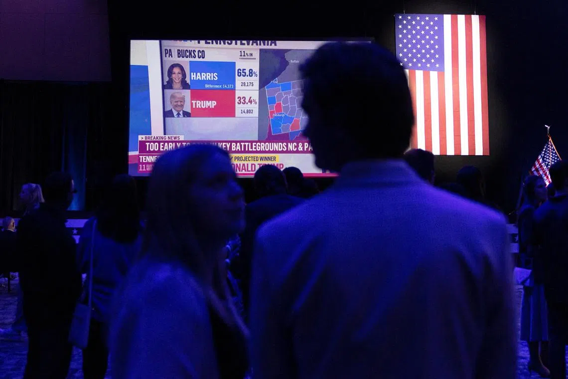 A screen shows election updates at a Sherrod Brown watch party in Columbus, Ohio, U.S., November 5, 2024. REUTERS/Megan Jelinger