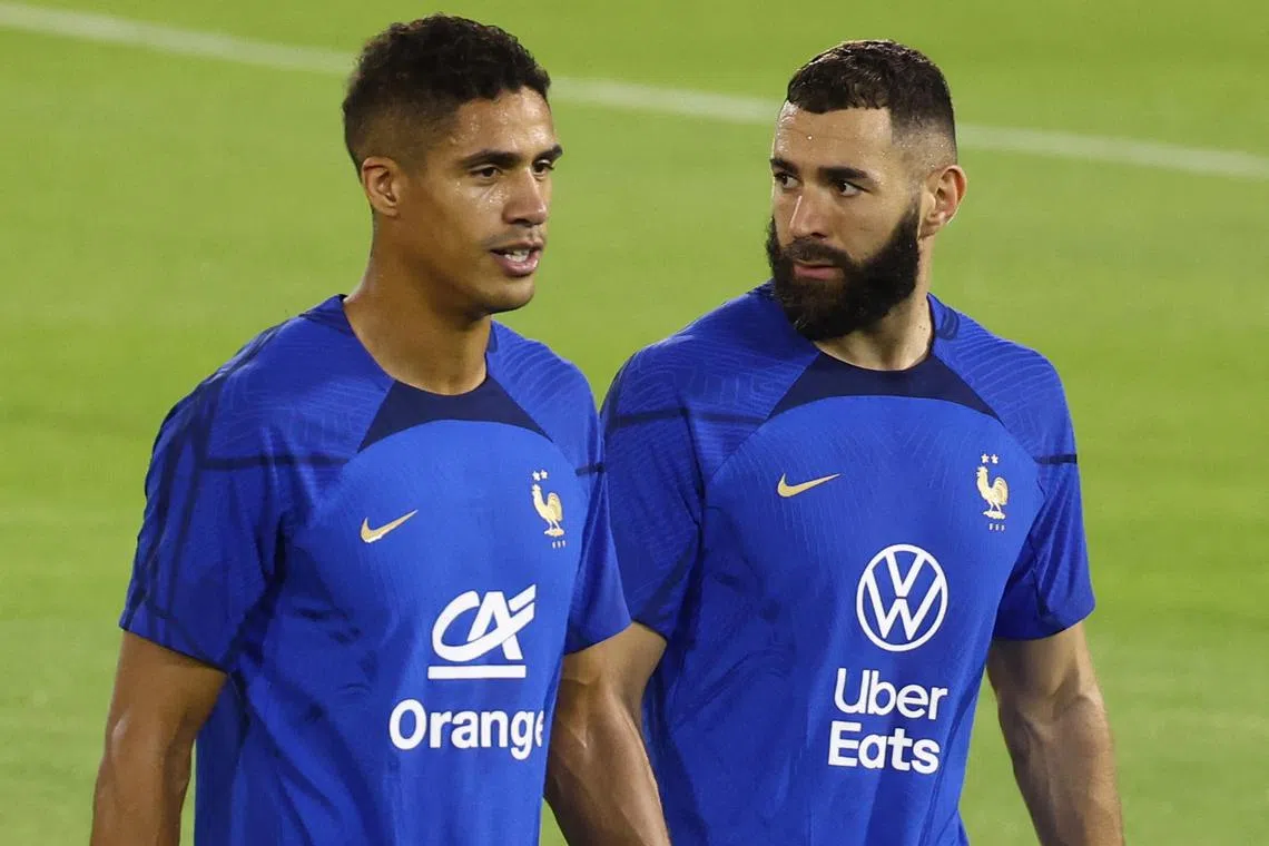 France's Raphael Varane (left) and Karim Benzema during a training session.