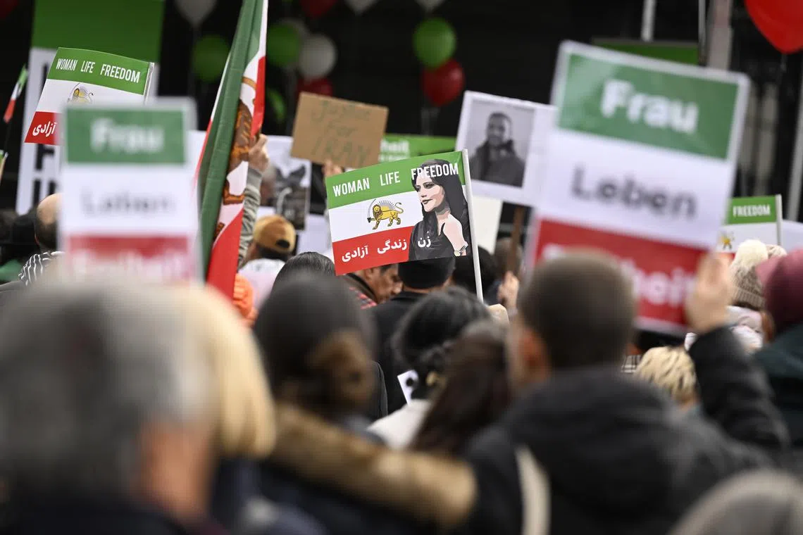 People take part in a freedom rally for Iranian women in Bern, Switzerland, on Nov 5, 2022.