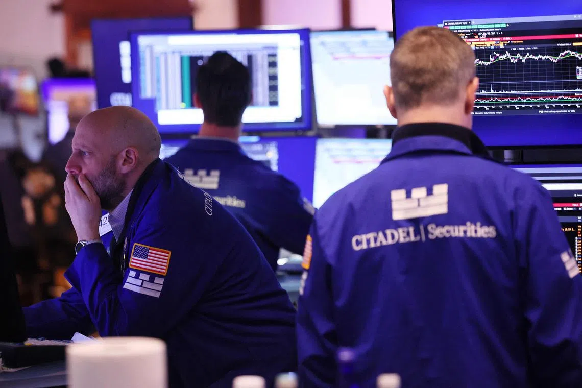 Traders working on the floor of the New York Stock Exchange, during morning trading, on March 4, in New York City.