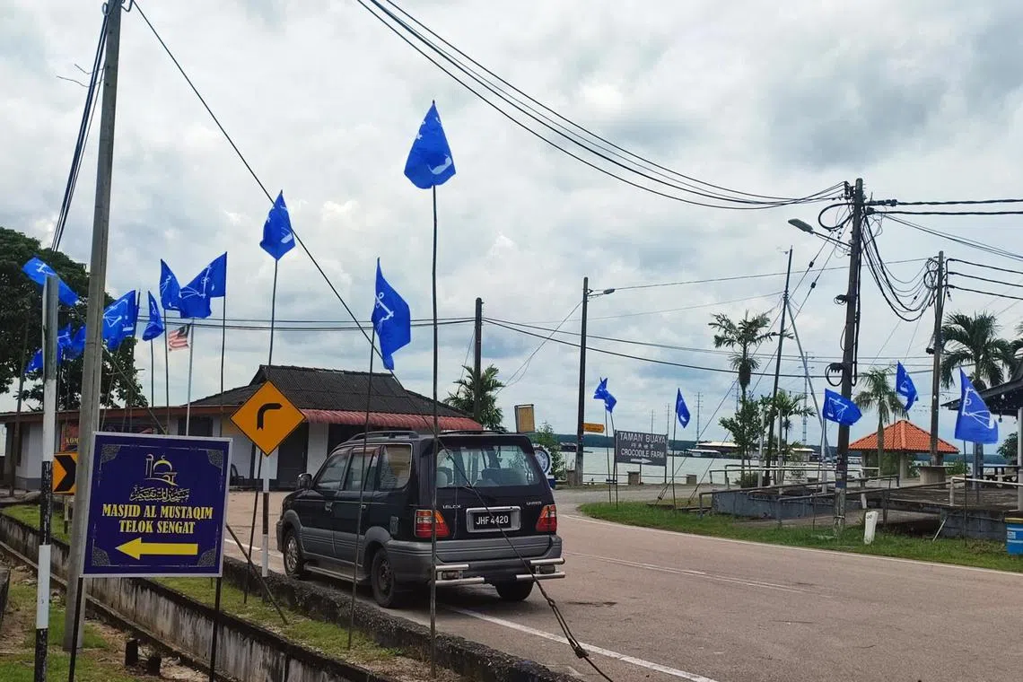 Barisan Nasional (BN) campaign flags seen hanging in the streets of Telok Sengat, a small town in Kota Tinggi district of Johor.