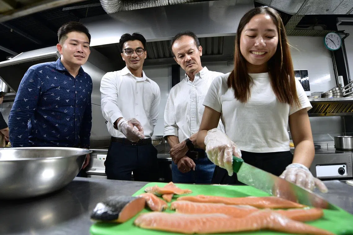 asgryouth - Nur Adilah and Clyde presenting their idea to salvage and repurpose meat off-cuts to Mr Joseph Soh, café owner, with Mr Dennis Lim, their lecturer and project supervisor, observing at the side.



Photos by NYAA