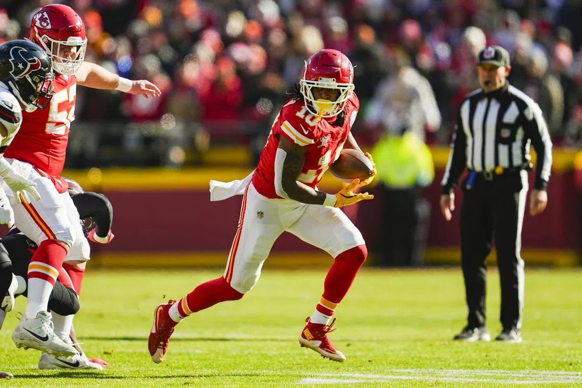 FILE PHOTO: Dec 21, 2024; Kansas City, Missouri, USA; Kansas City Chiefs running back Isiah Pacheco (10) runs the ball during the first half against the Houston Texans at GEHA Field at Arrowhead Stadium. Mandatory Credit: Jay Biggerstaff-Imagn Images/File photo