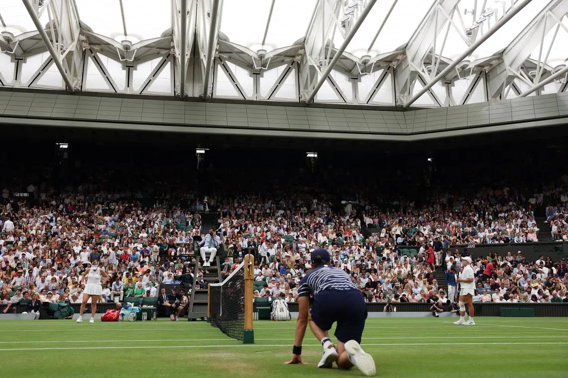 FILE PHOTO: Tennis - Wimbledon - All England Lawn Tennis and Croquet Club, London, Britain - July 6, 2025 General view as play is stopped due to a line call system fault during her round of 16 match between Russia's Anastasia Pavlyuchenkova and Britain's Sonay Kartal REUTERS/Isabel Infantes/File Photo