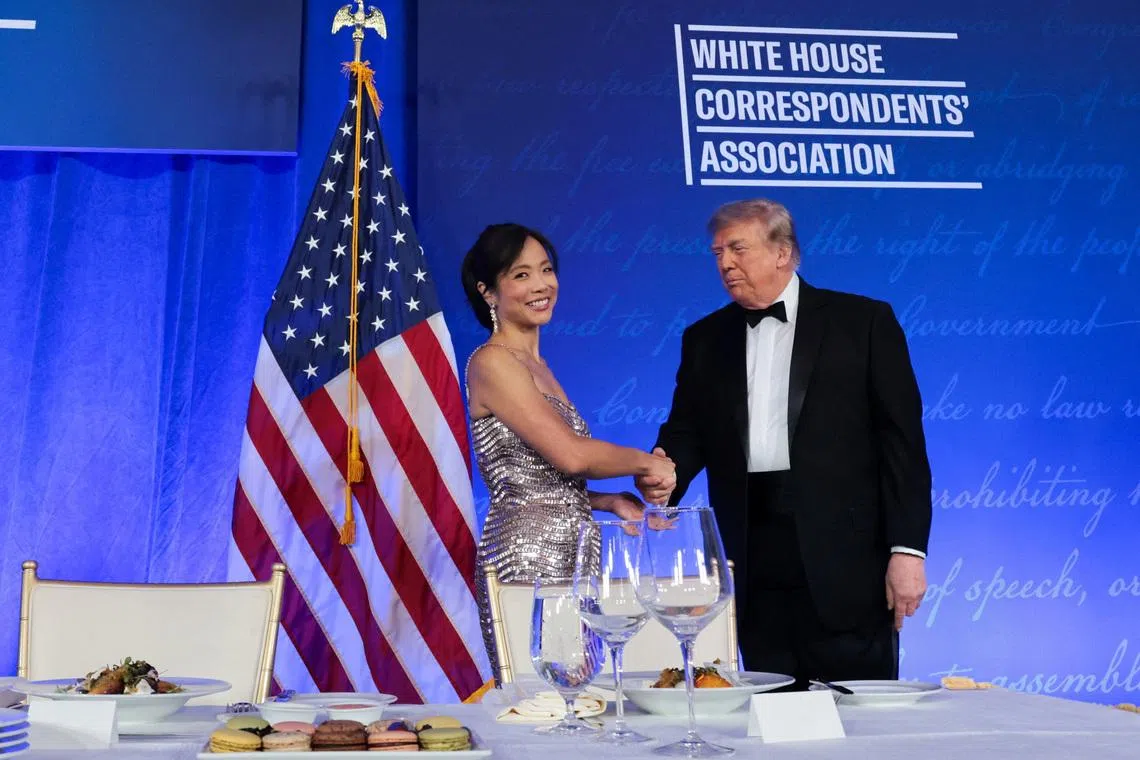 US President Donald Trump (right) shake hands with CBS News senior White House correspondent Weijia Jiang at the White House Correspondents’ Association Dinner on July 24.