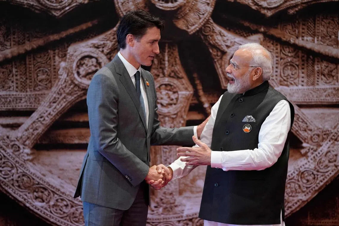 India's Prime Minister Narendra Modi (right) with Canada's Prime Minister Justin Trudeau ahead of the G20 Leaders' Summit in New Delhi on Sept 9, 2023.