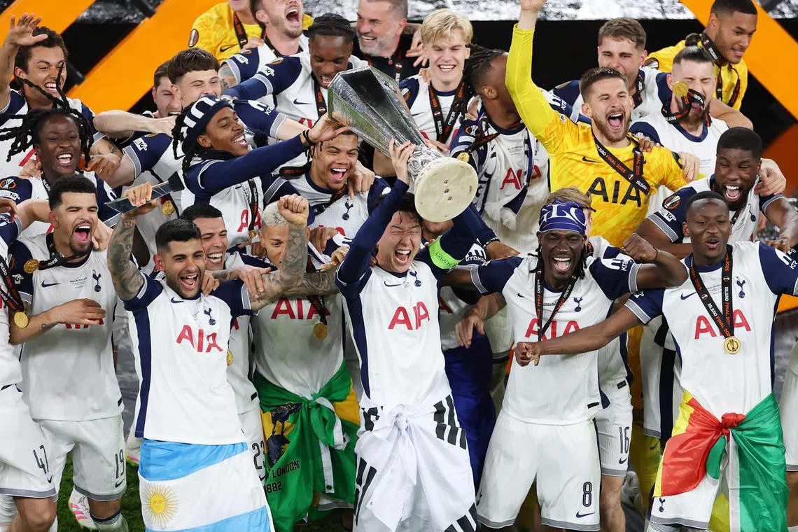 Tottenham Hotspur's Son Heung-min lifting the trophy as he celebrates with  teammates after winning the Europa League final on May 21.