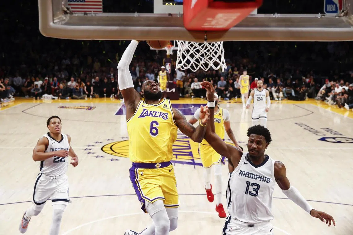Los Angeles Lakers forward LeBron James drives to the basket while being guarded by Memphis Grizzlies forward Jaren Jackson Jr during the second half of Game 6 of their NBA Western Conference play-offs.