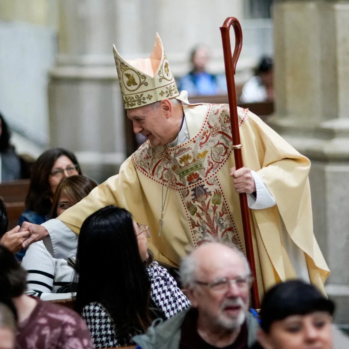 Archbishop Gabriele Caccia, permanent observer of the Holy See to the United Nations, greets parishioners before Mass for the late Pope Francis, at St. Patrick's Cathedral in New York City, U.S., April 26, 2025. REUTERS/Eduardo Munoz/File Photo