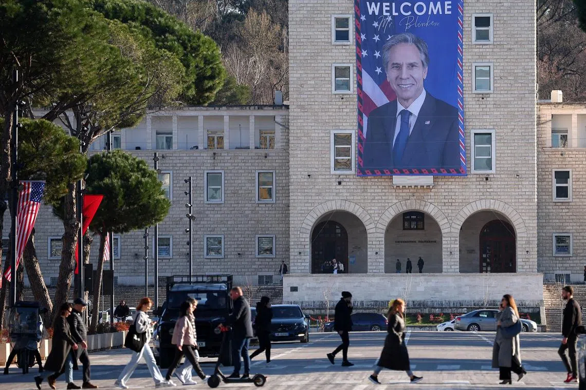 A welcome banner depicting US Secretary of State Antony Blinken is seen in Albania's capital, Tirana, ahead of his visit.