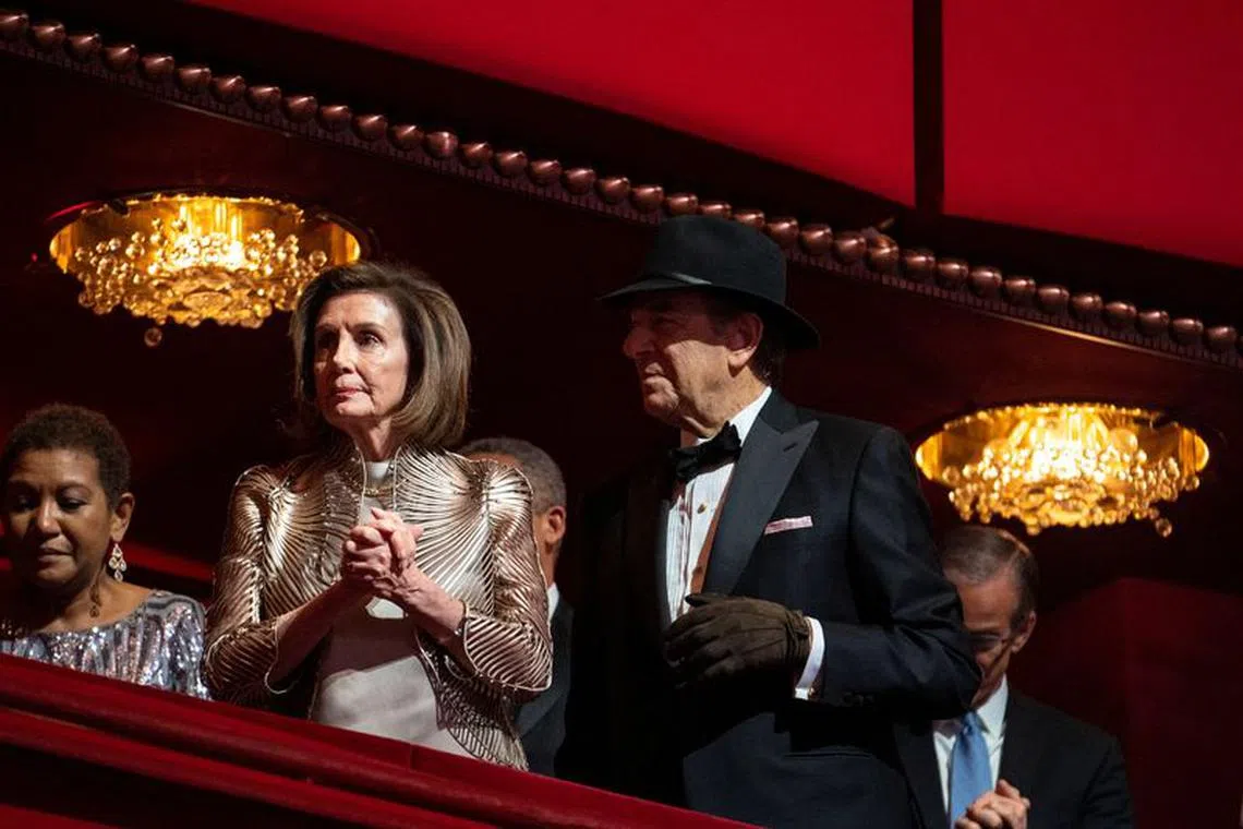 House Speaker Nancy Pelosi and her husband Paul Pelosi, who is wearing a hat and glove following an attack by accused David Wayne DePape in his home in November, attend the Kennedy Center honorees gala in Washington, D.C., U.S., December 4, 2022. REUTERS/Sarah Silbiger/File Photo