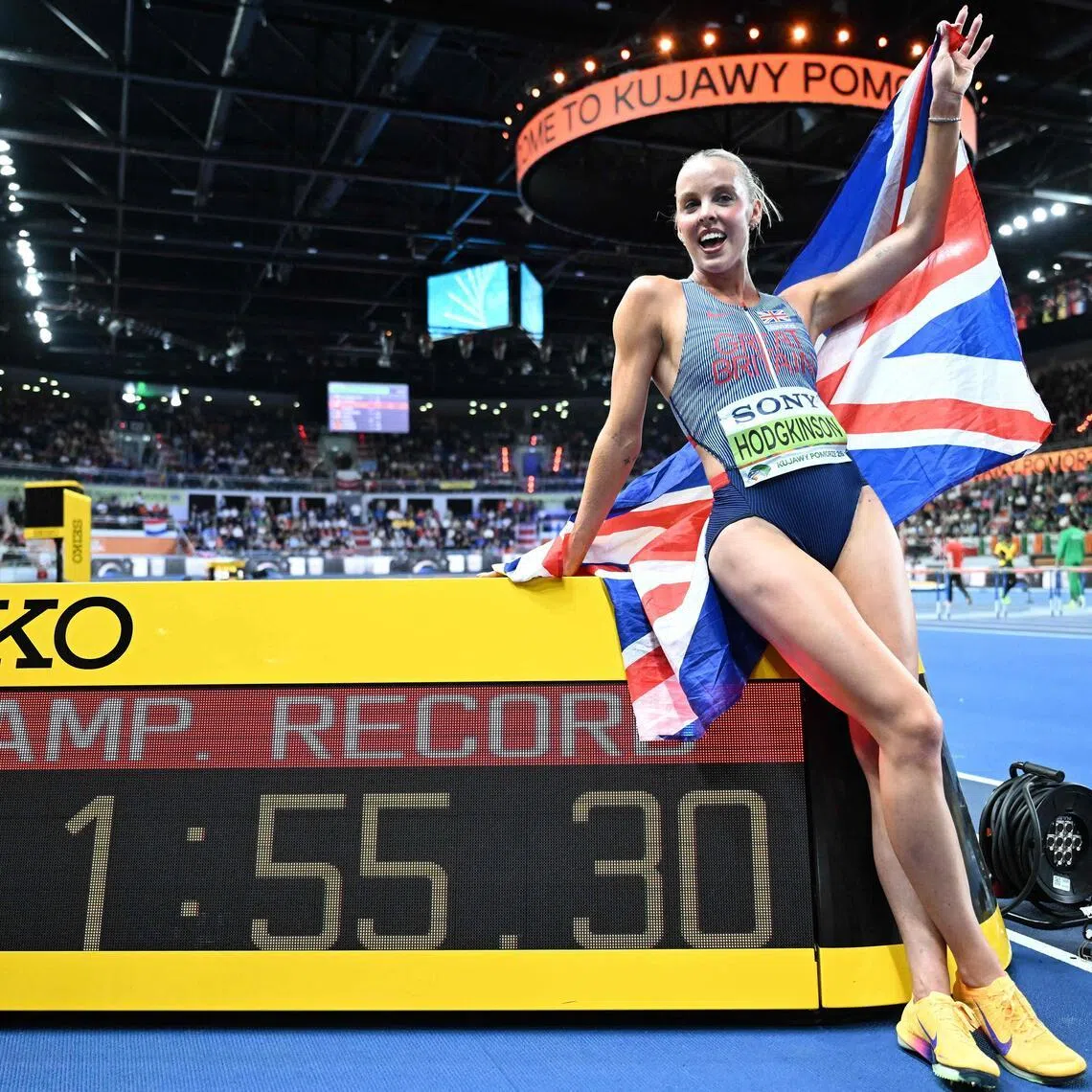Britain's Keely Hodgkinson celebrates winning the women's 800 metres during the World Athletics Indoor Championships Kujawy Pomorze 2026 in Torun, Poland, on March 22, 2026.