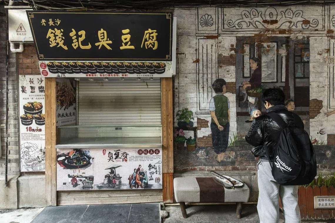 A shuttered shop at Tianzifang, a once-popular food and beverage area that saw wall-to-wall crowds, in Shanghai, on Dec 11.