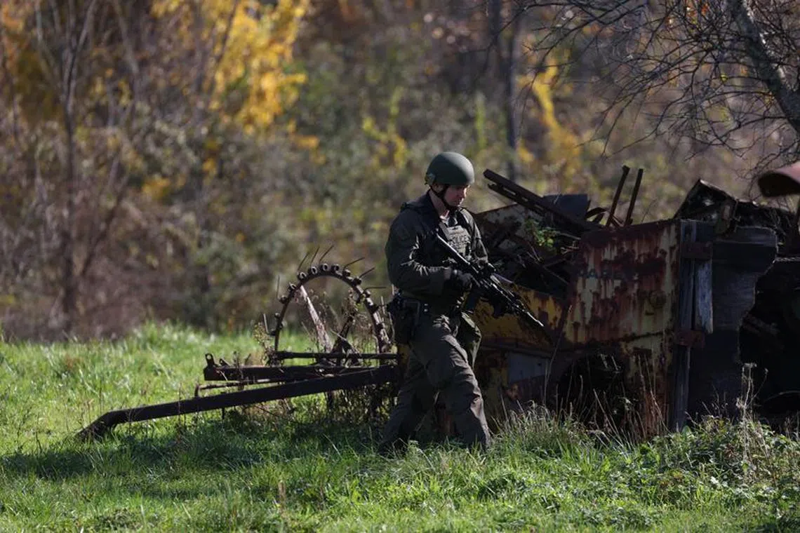 A member of law enforcement works as the search for the suspect in the deadly mass shootings in Lewiston continues, in Monmouth, Maine, U.S. October 27, 2023. REUTERS/Shannon Stapleton