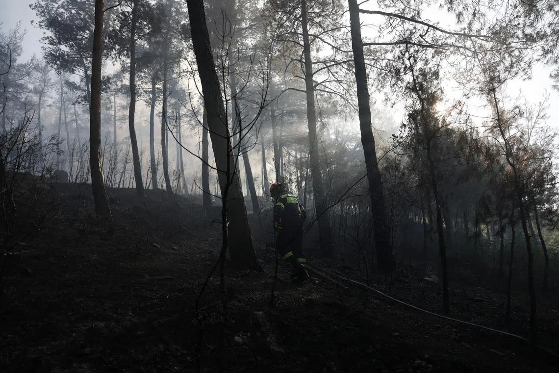 Two dead as wildfires gut house in northern Greece as village evacuated