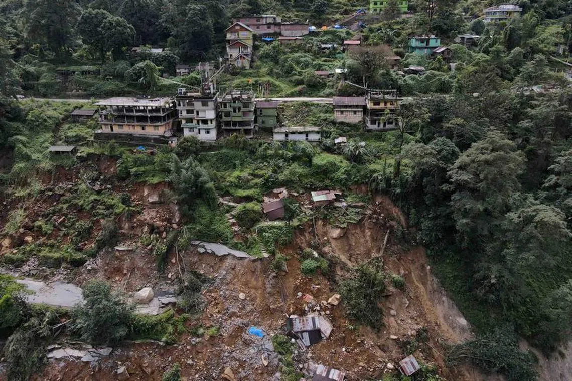 FILE PHOTO: A drone view of damaged roads and houses that were washed away by flash floods in Naga-Namgor village, Sikkim, India, October 10, 2023. REUTERS/Francis Mascarenhas/File Photo