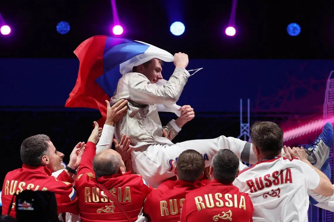 Russia’s Pavel Graudyn celebrates with teammates after winning the senior men’s sabre final match against South Korea’s Do Gyeong-dong at the World Fencing Championships in Hong Kong on July 28.
